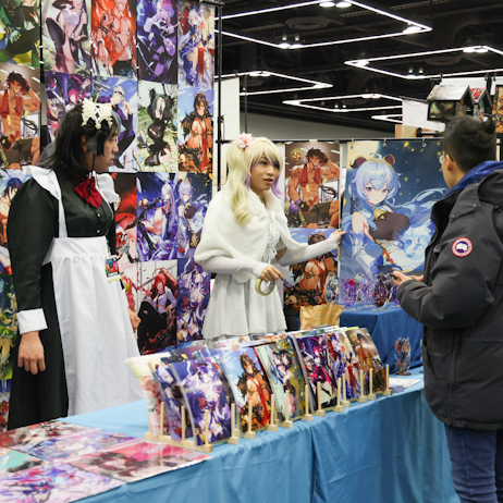 Artist talking to fan about their work