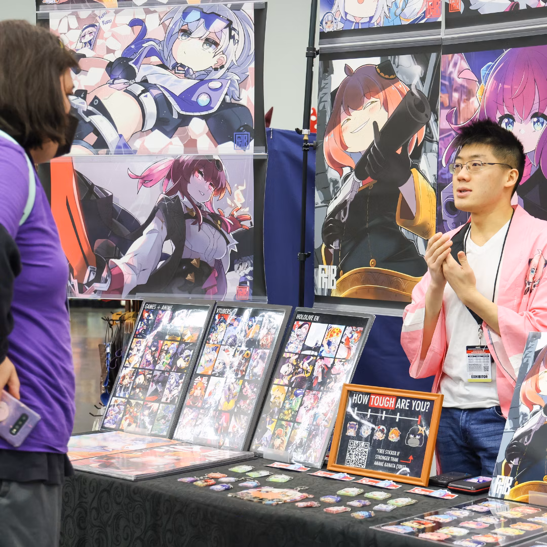 Artist vendor talking to patron