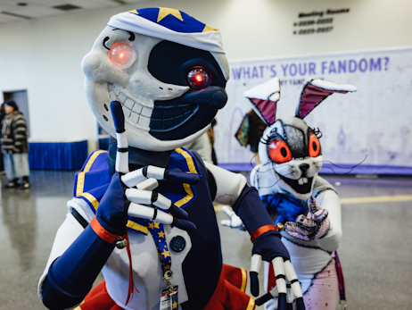 Two cosplayers posing, dressed as two characters from the video game Five Nights at Freddy's.