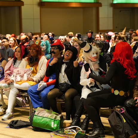 An excited audience begins belting out the words at our Hazbin Hotel singalong.