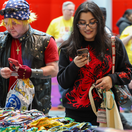 Fans admiring the merch booths