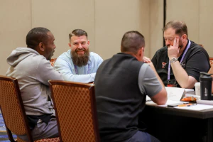 Training participants connect and share experiences during an instructor-led HDI certification course.