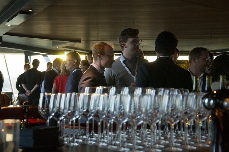 Attendees networking at the investor syndication reception