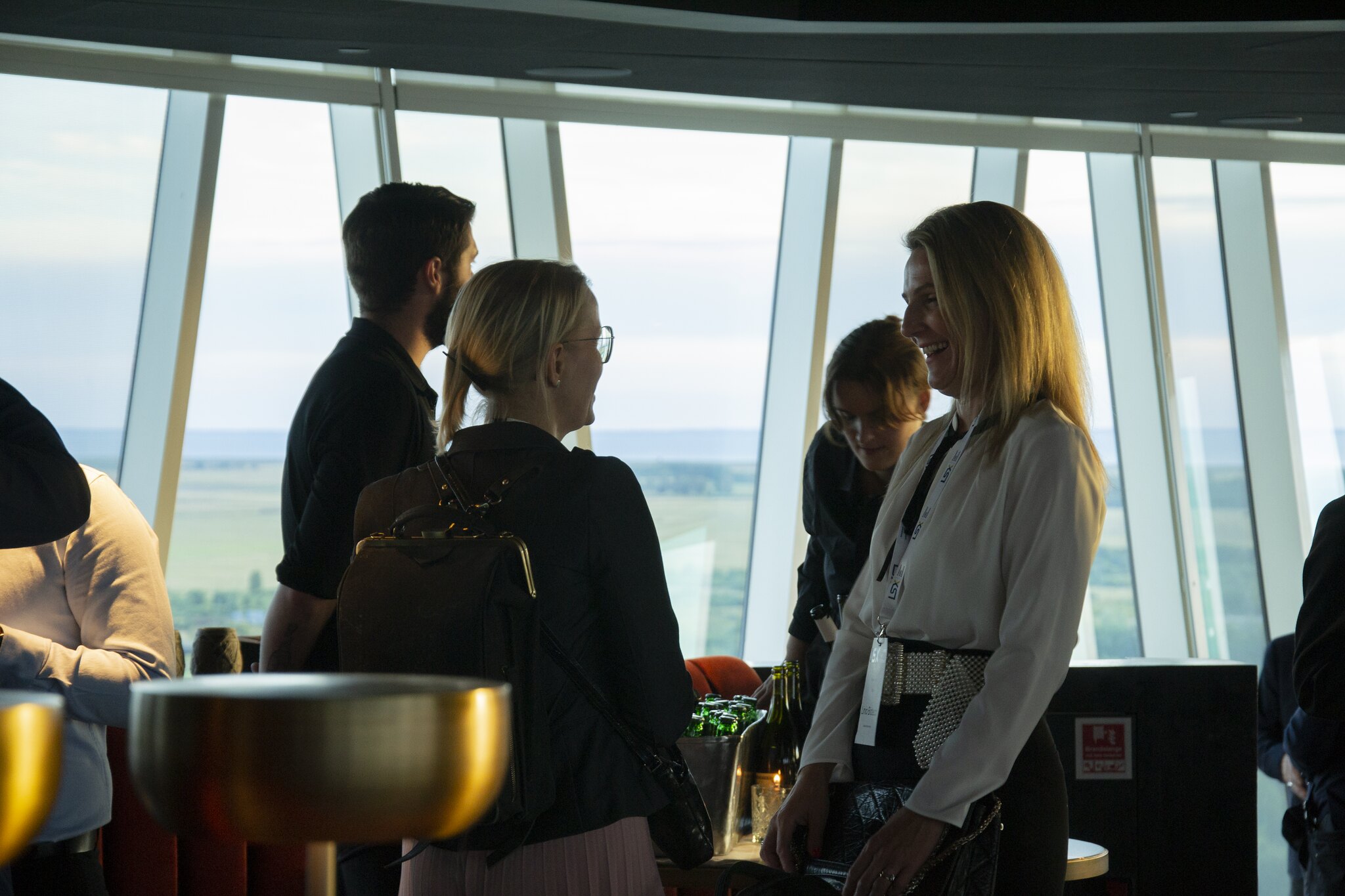 Attendees networking at the investor syndication reception