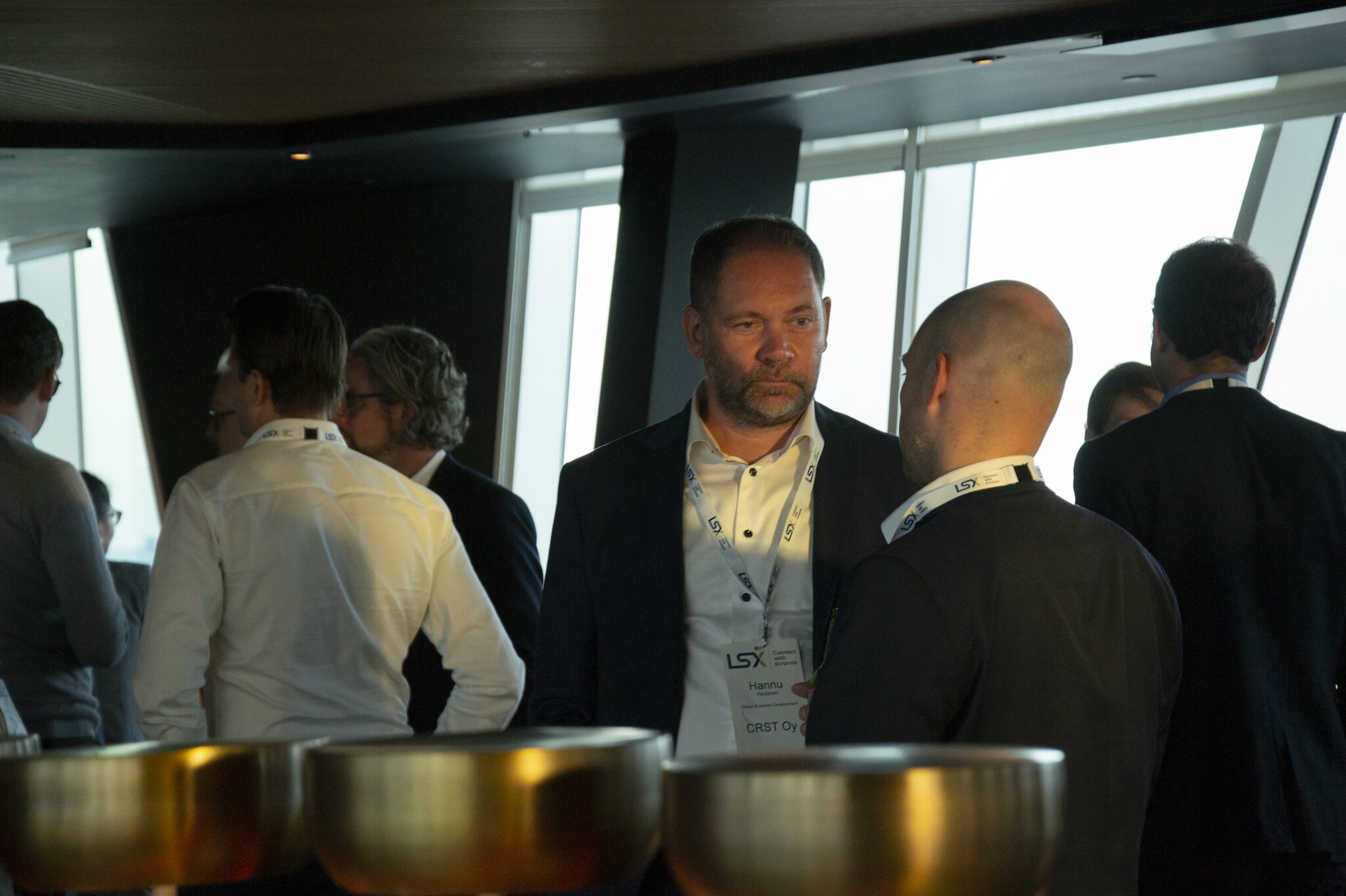 Attendees networking at the investor syndication reception
