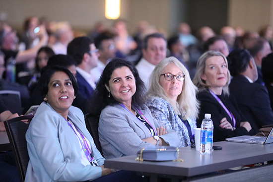 Enterprise Communications Conference attendees in a keynote session