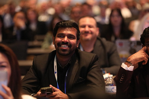 Enterprise Communications Conference attendee in a session