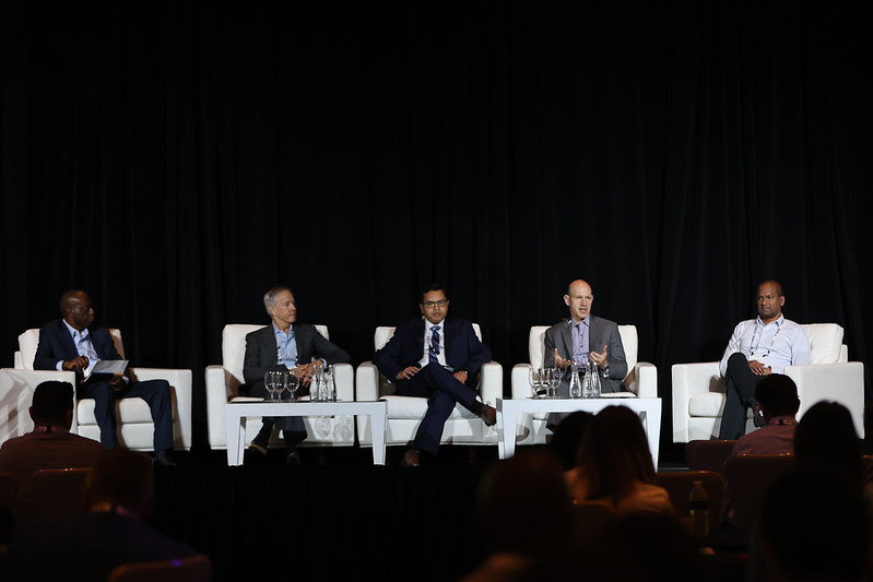 Portrait of Bethany McLeanr against a green background
