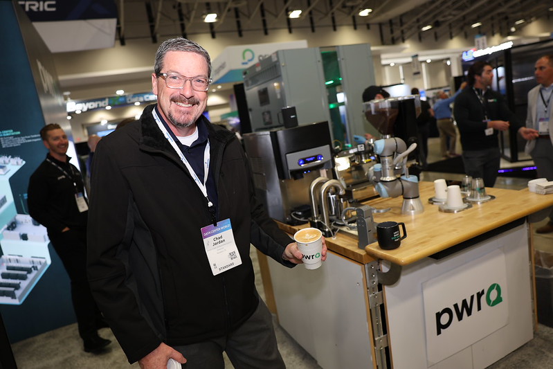Data Center World Attendee holding coffee with custom latte art
