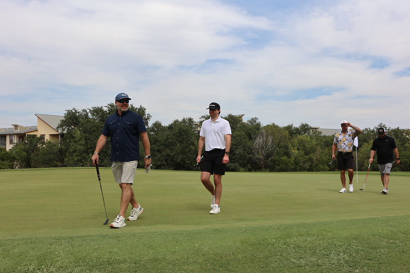 People golfing at golf outing