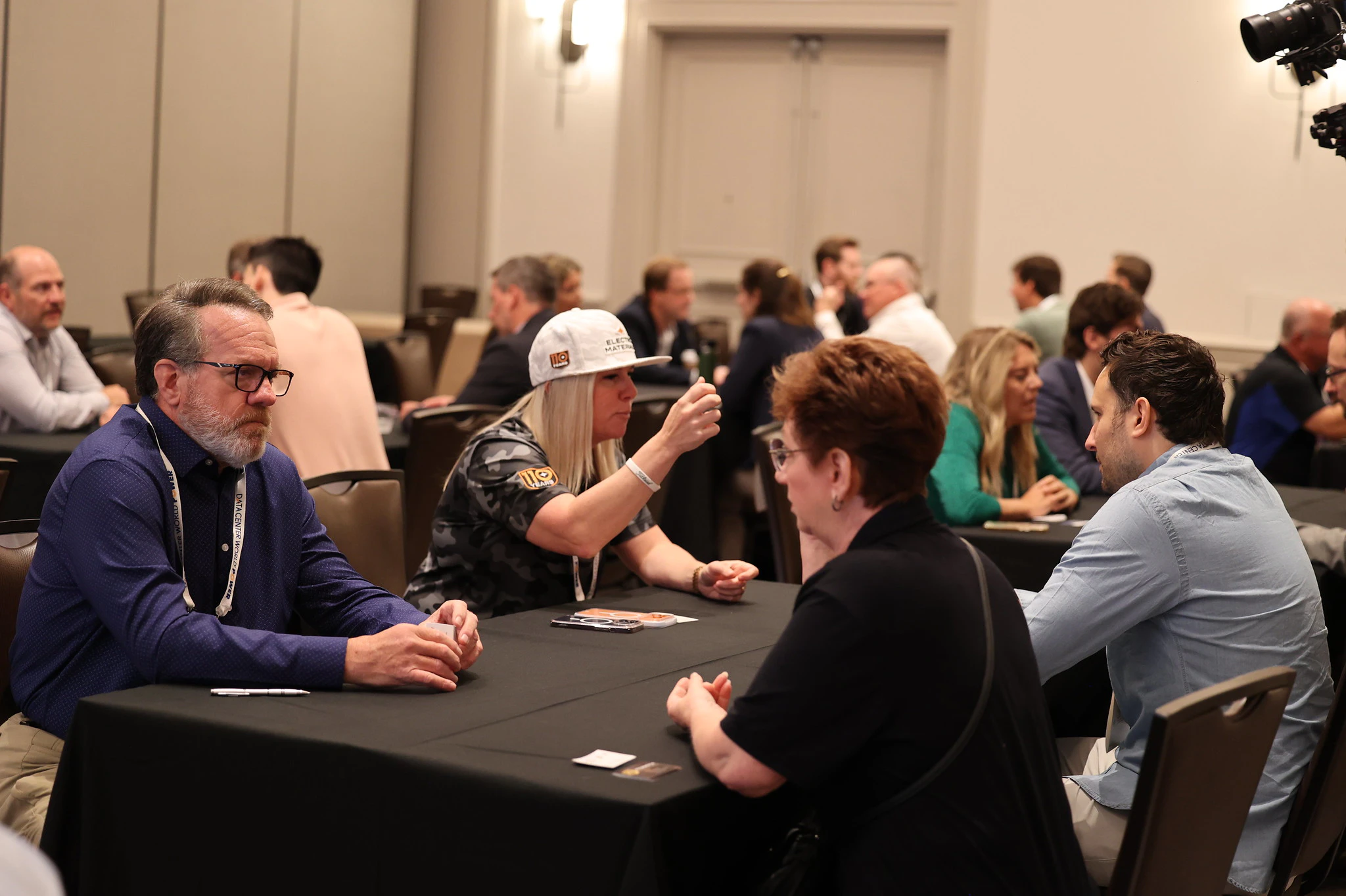 Attendees listening to speaker with overlay text Data Center Professionals