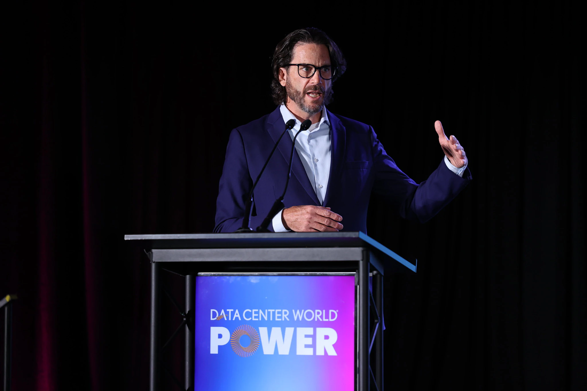 Attendees listening to speaker with overlay text Industry thought leaders