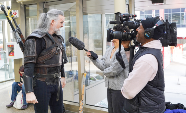 The Witcher cosplayer, who travelled from Switzerland to be at Toronto Comicon, is interviews for local news.