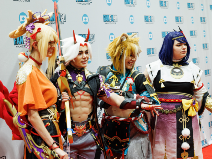 Four cosplayers in various anime character cosplays