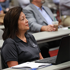 Women sitting in on a conference session at Organics Recycling