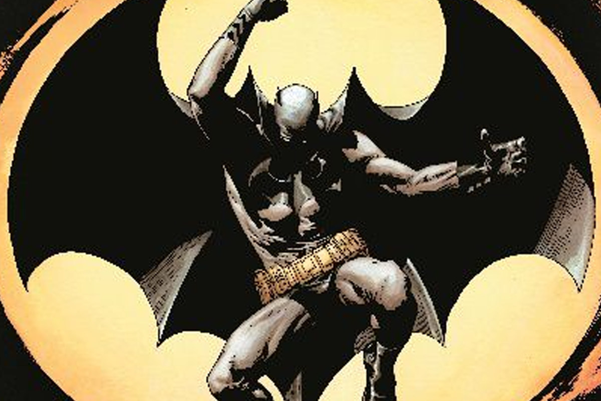 Batman poses mid air with the moon as his backdrop