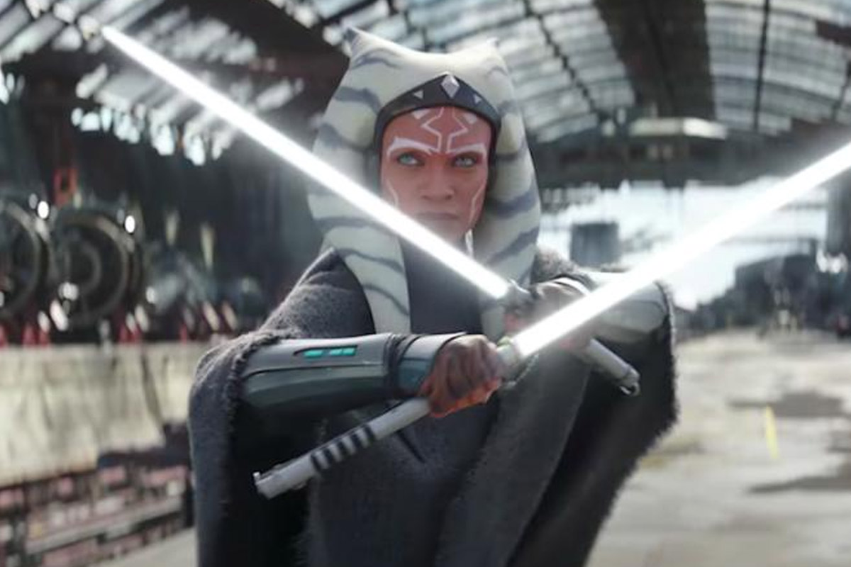 Ahsoka Tano in live action poses with her double light sabers