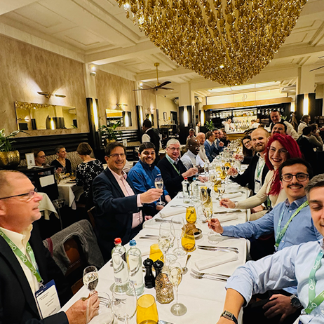 Attendees connecting at World Ethanol & Biofuels in Brussels, discussing business opportunities during evening networking reception.