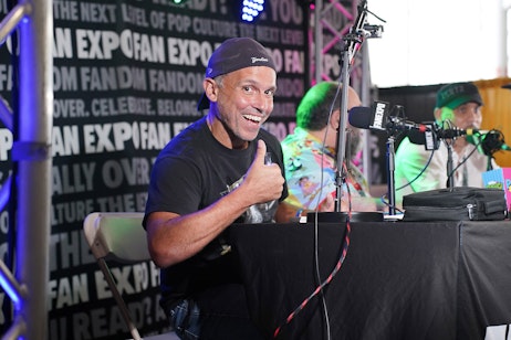 a man giving a thumbs up on the boston creator stage