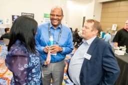 Group of 3 having a conversation at the Healthcare Waste Conference