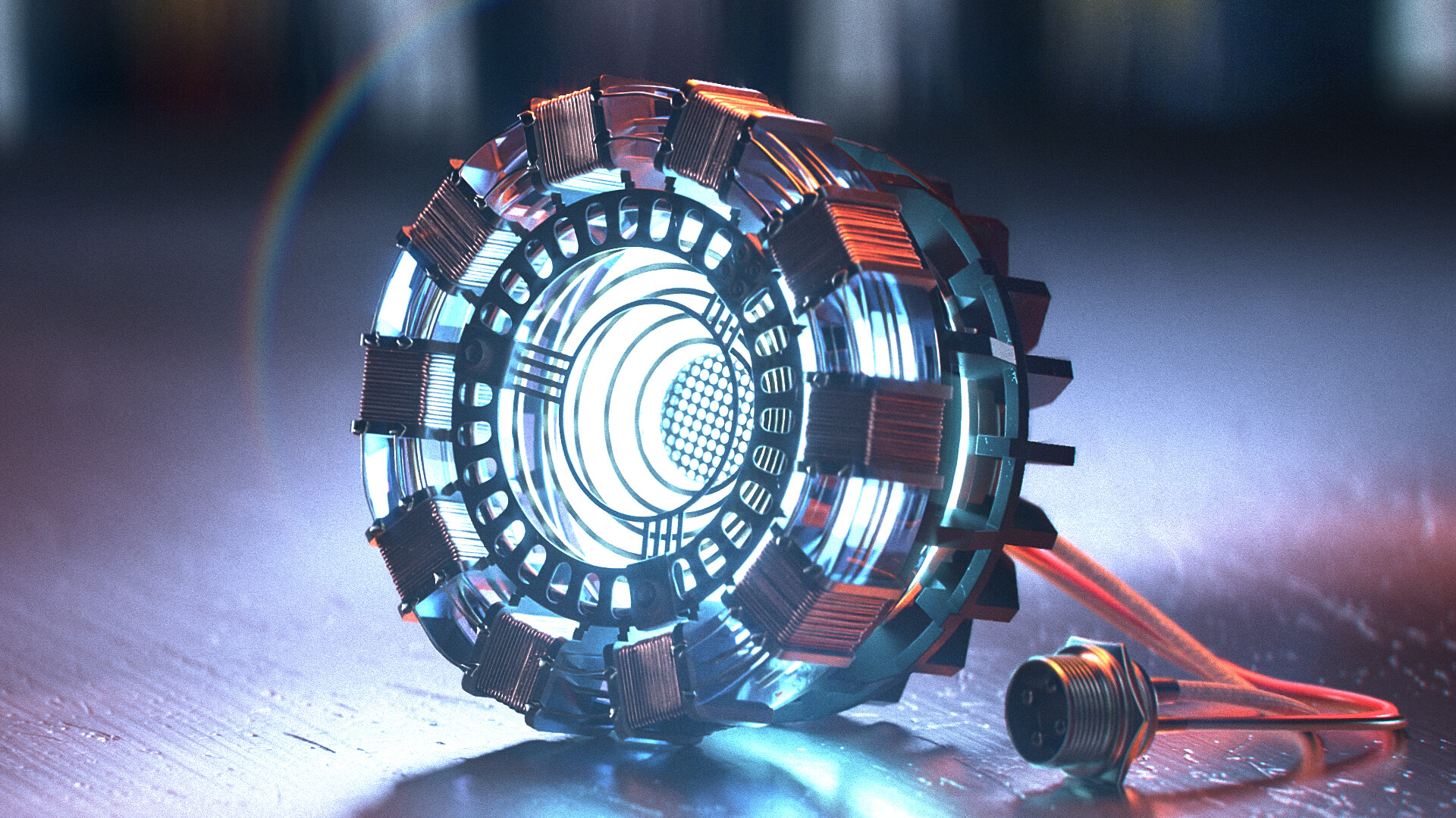 An unattache arc reactor lays on the floor of Tony Stark's lab illuminated. The shine from the light causing a small rainbow over the device