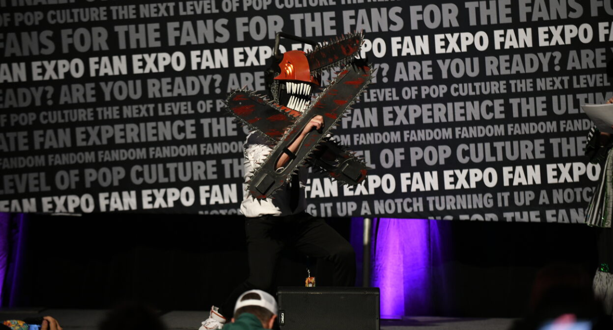 Denji from chainsaw man. The eyes glow, and the chains on his chainsaw hands and mask rotate