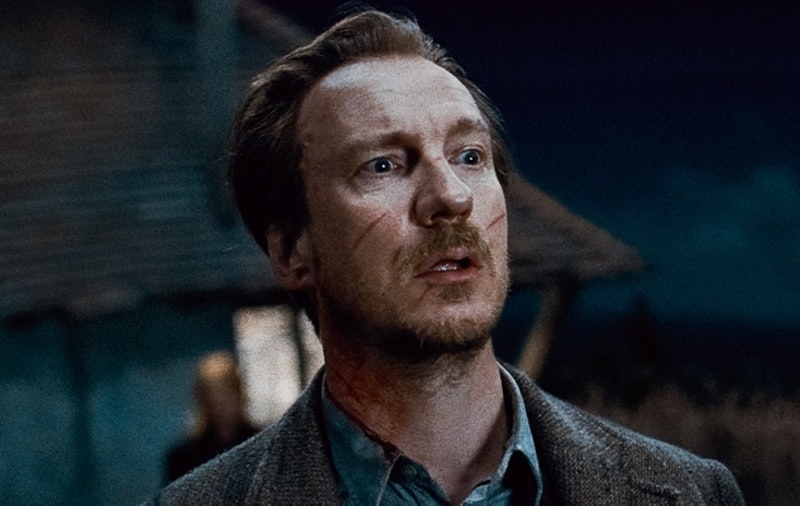 Remus, with scars across his face, looks concerned