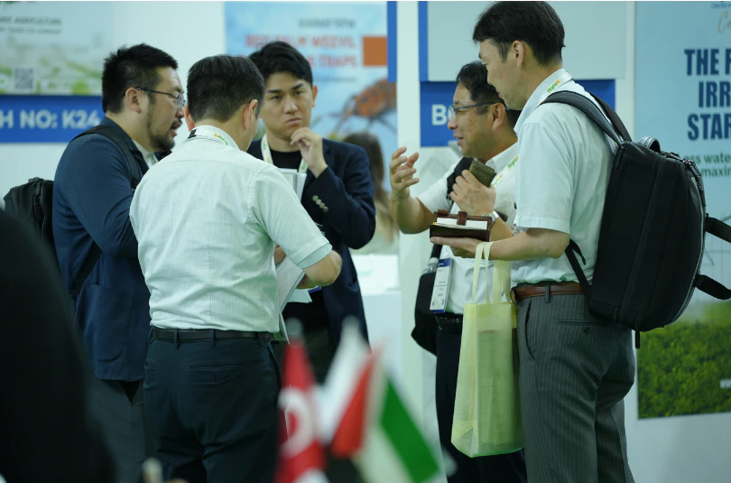 Livestock industry professionals discussing animal farming technologies at Growtech Middle East