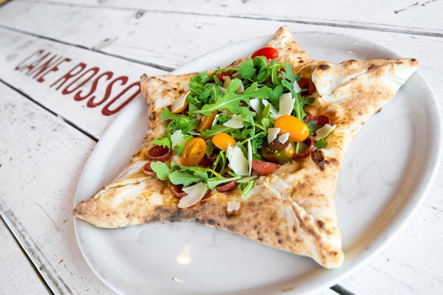 A photo of a star shaped pizza.