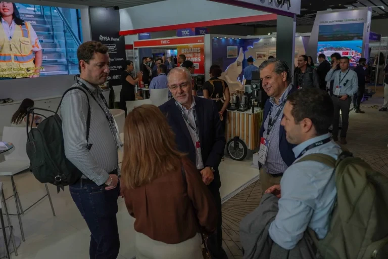 Attendees gathered and networking on the exhibition floor.