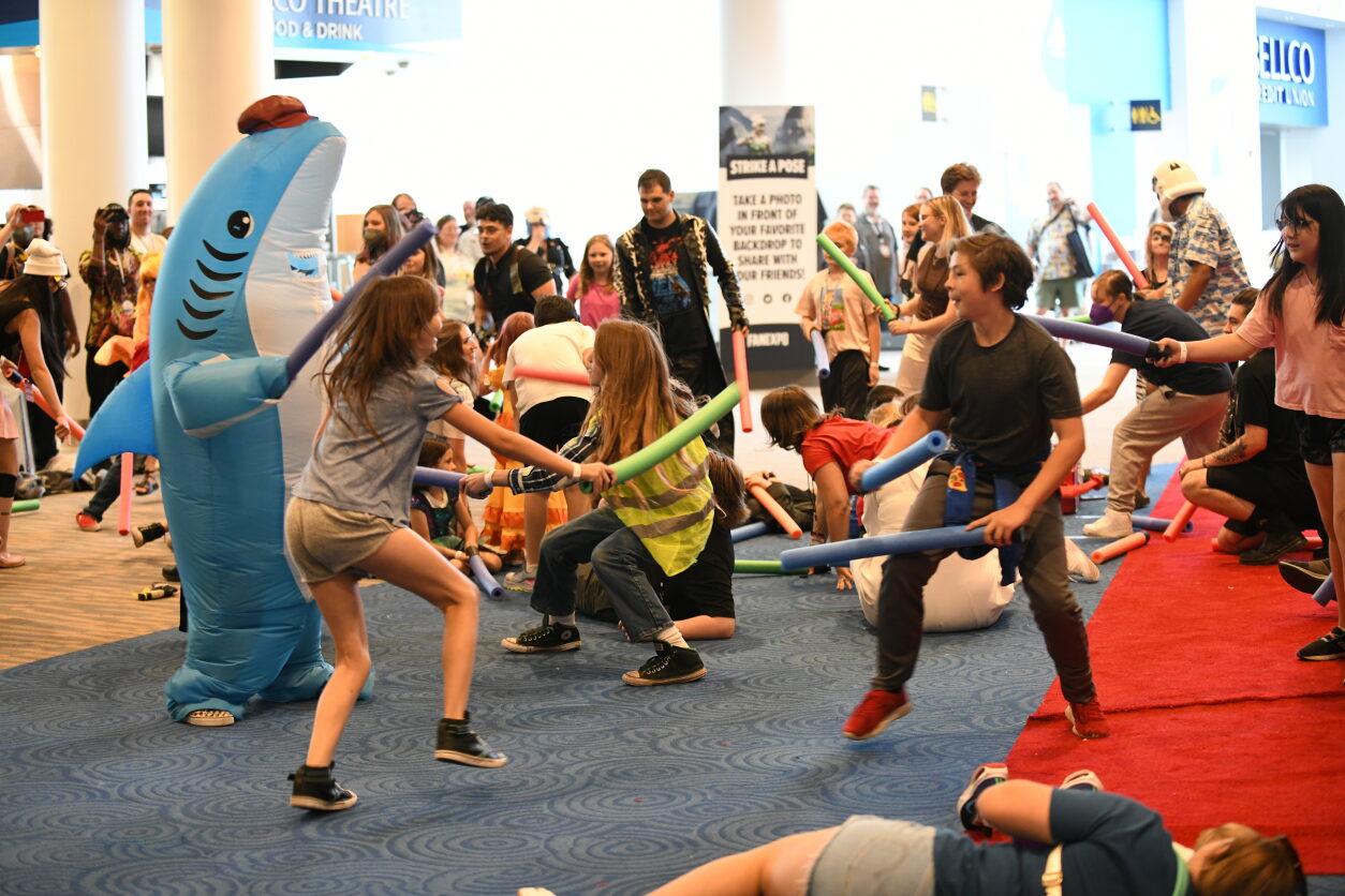 Jedi Master Shark faces off against a group of kids in our lightsaber battle
