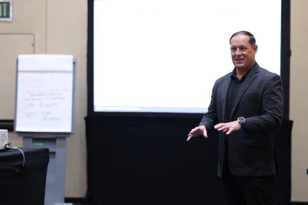 Instructor Josh Streets teaches an AI in the Support Organization class, presenting practical applications of AI to IT professionals.