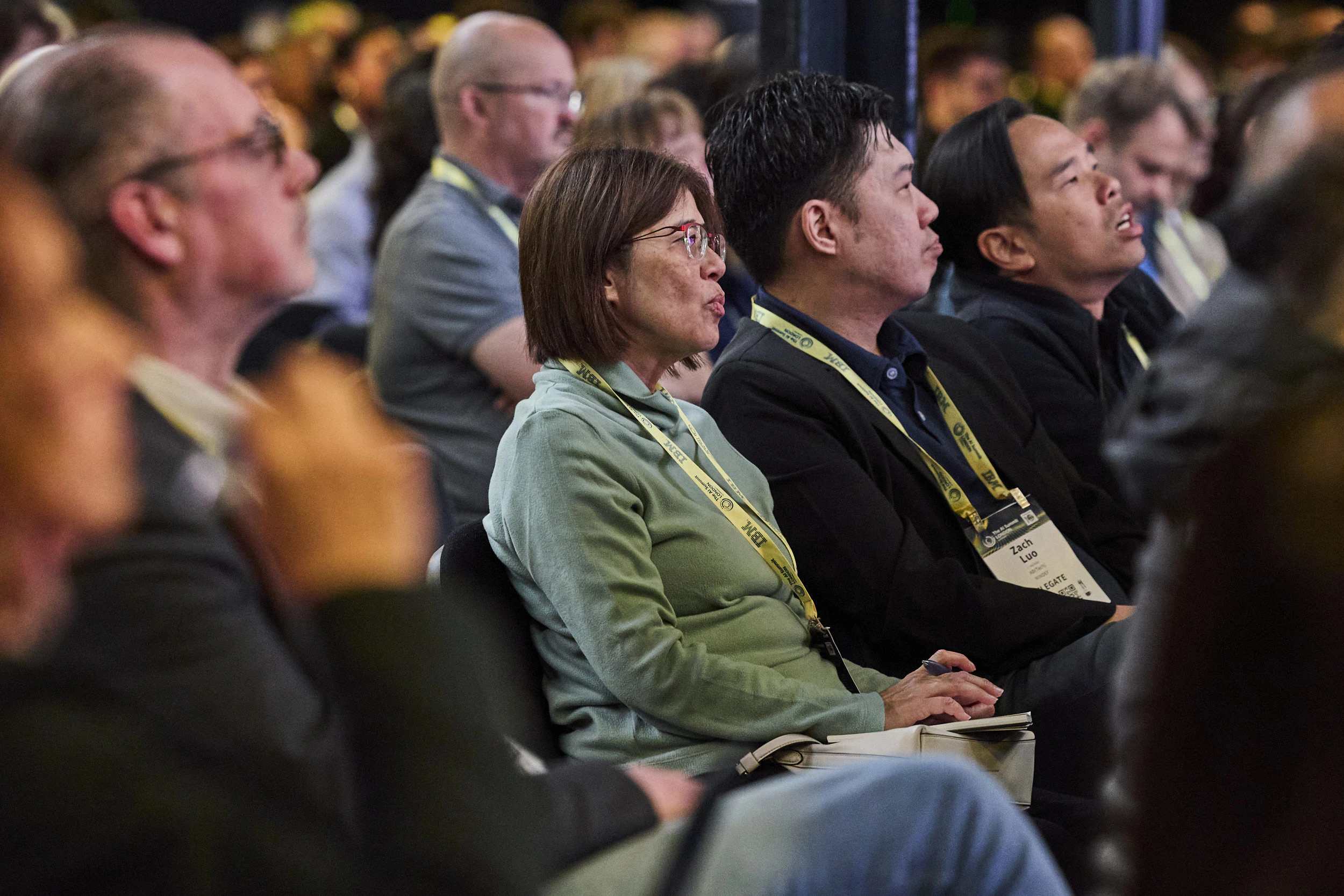 Audience members listening to a presentation at The AI Summit London