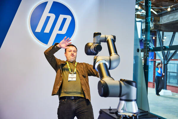 Man enjoying a robotic exhibitor demo