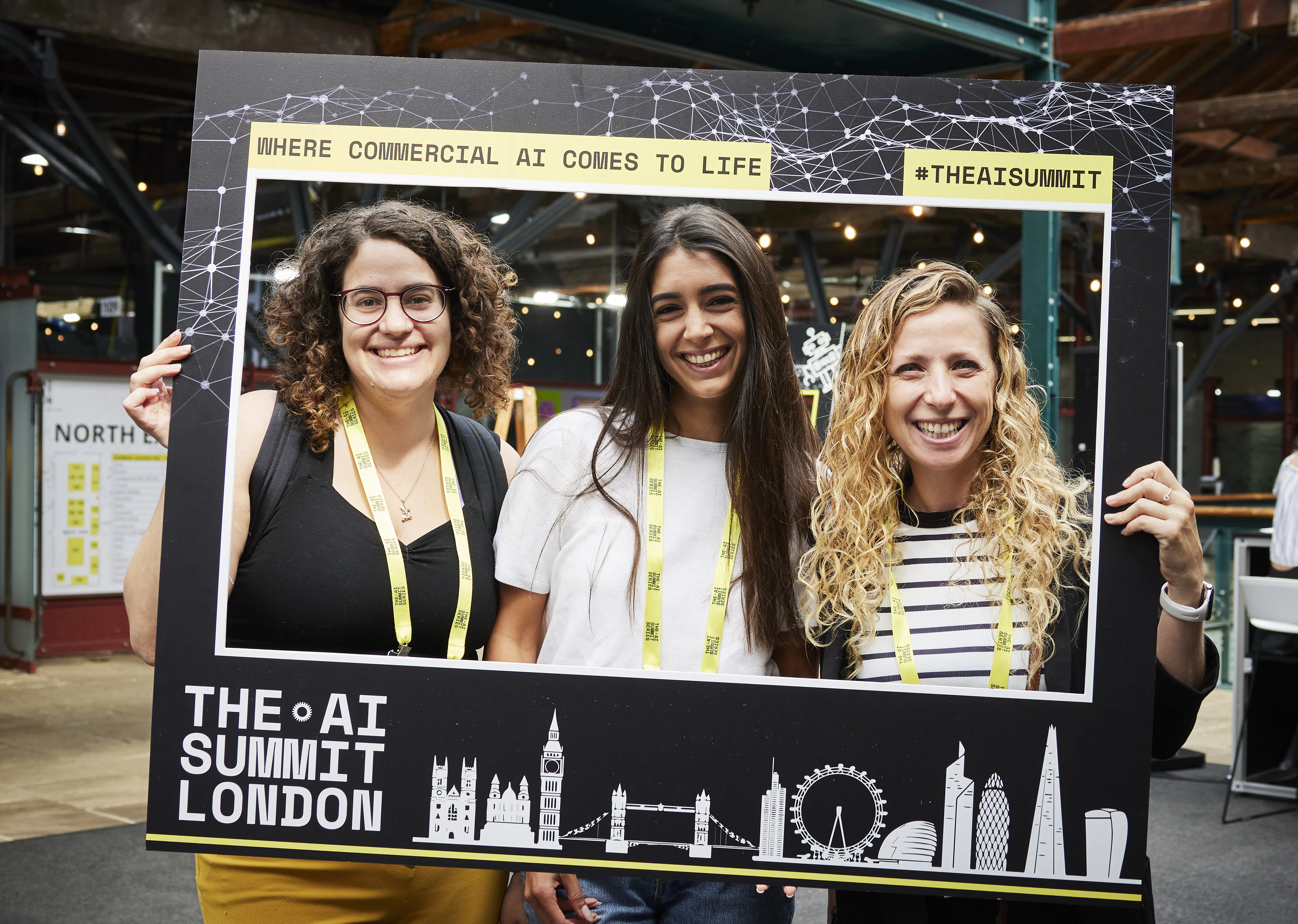 Ladies enjoying The AI Summit London in a selfie frame