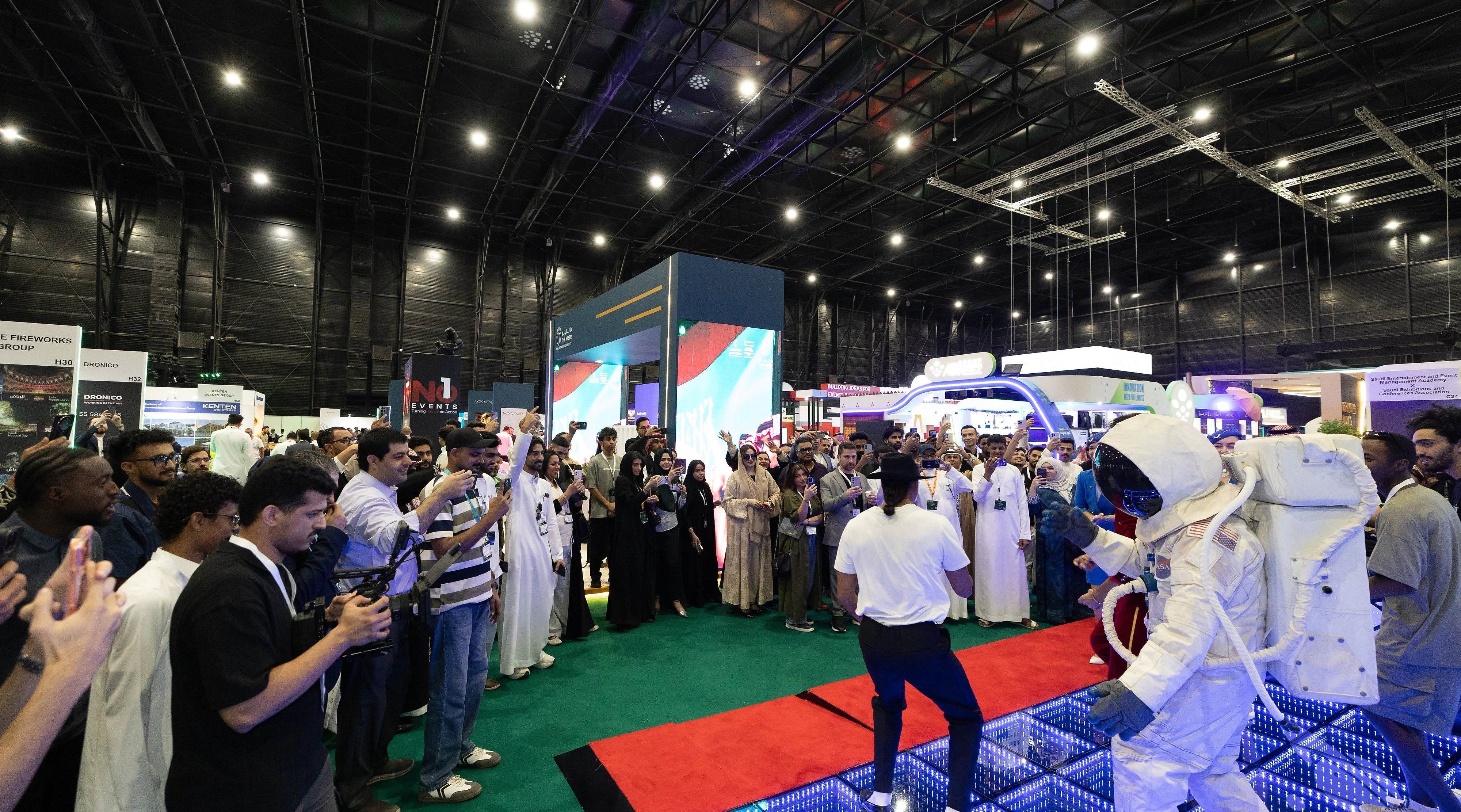 Visitors engaging with an experience at SES 2026 in Riyadh