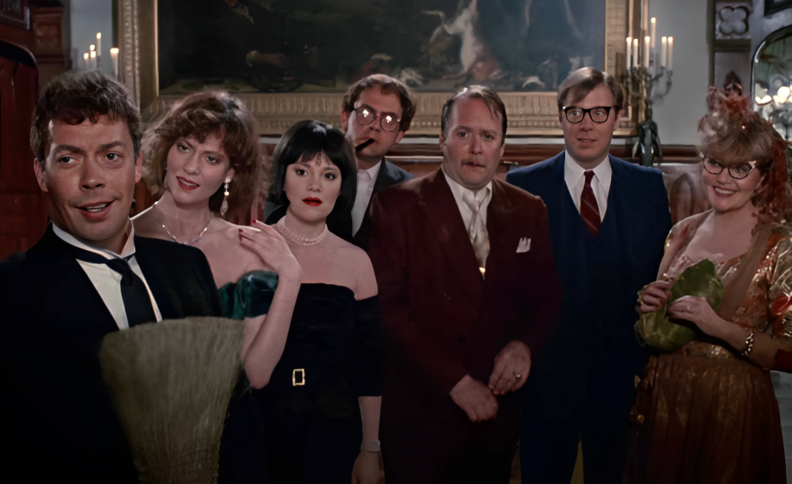 All of the party's staff and attendees stand in the hallway - their faces in varying states of smiles and confusion