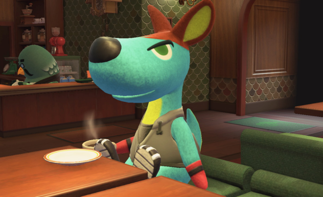 With a coffee, Rooney (a blue kangaroo) sits in Brooster's cafe.