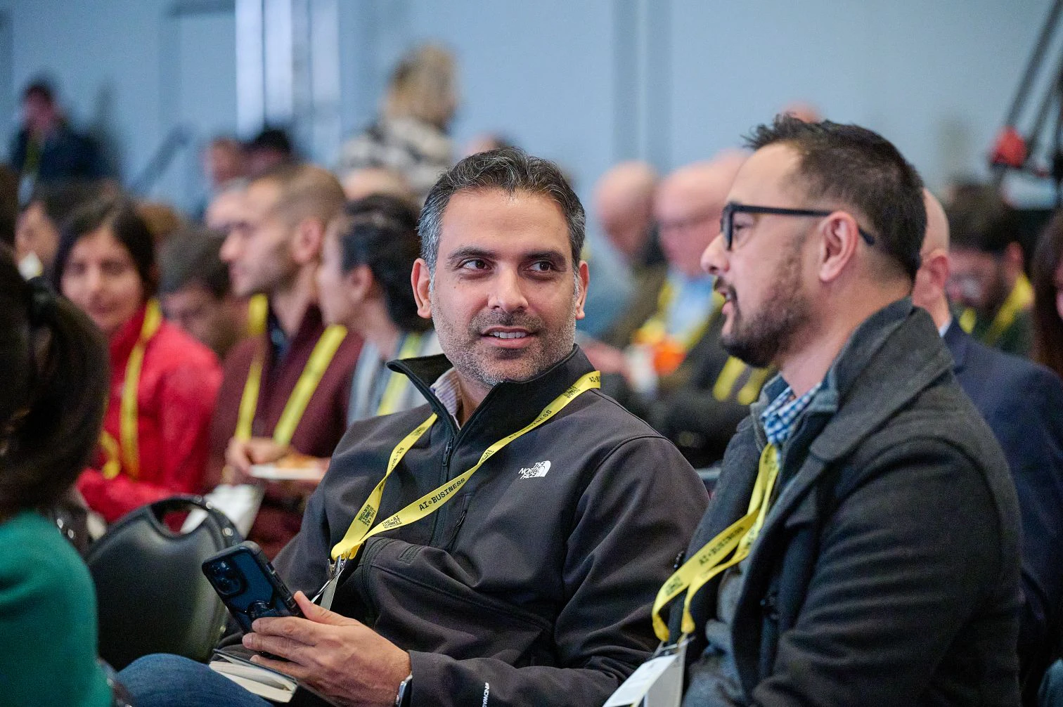 Audience members chat at The AI Summit New York