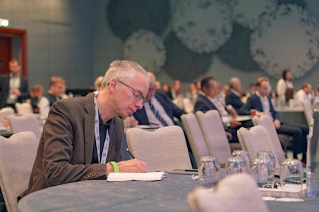 Audience taking notes at Flame