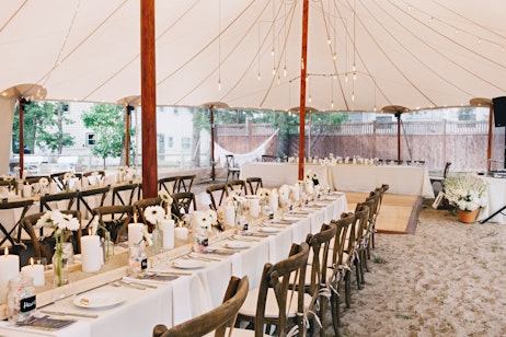 outdoor tent venue with white decor