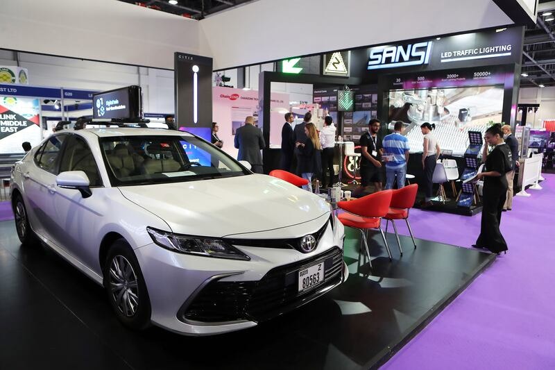 An image of the Intermobility Expo with a white car on display