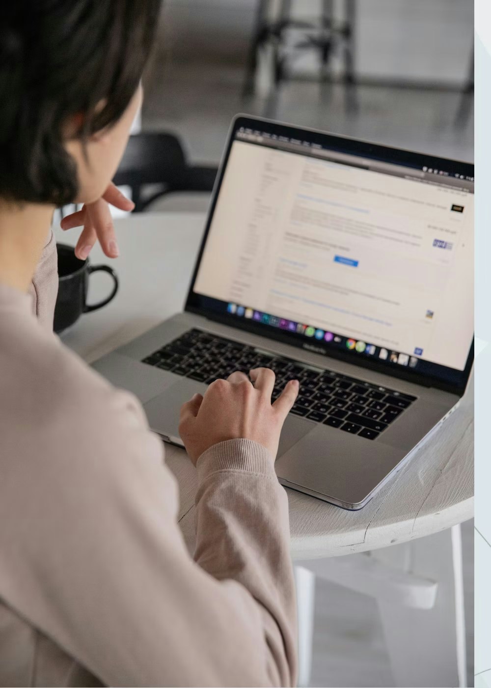 Woman working on laptop learning more about the partnering lab