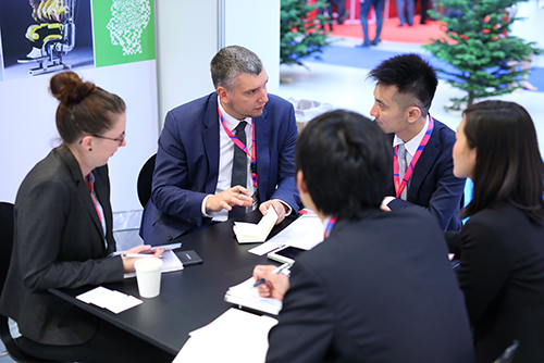 partnering meeting at exhibit booth