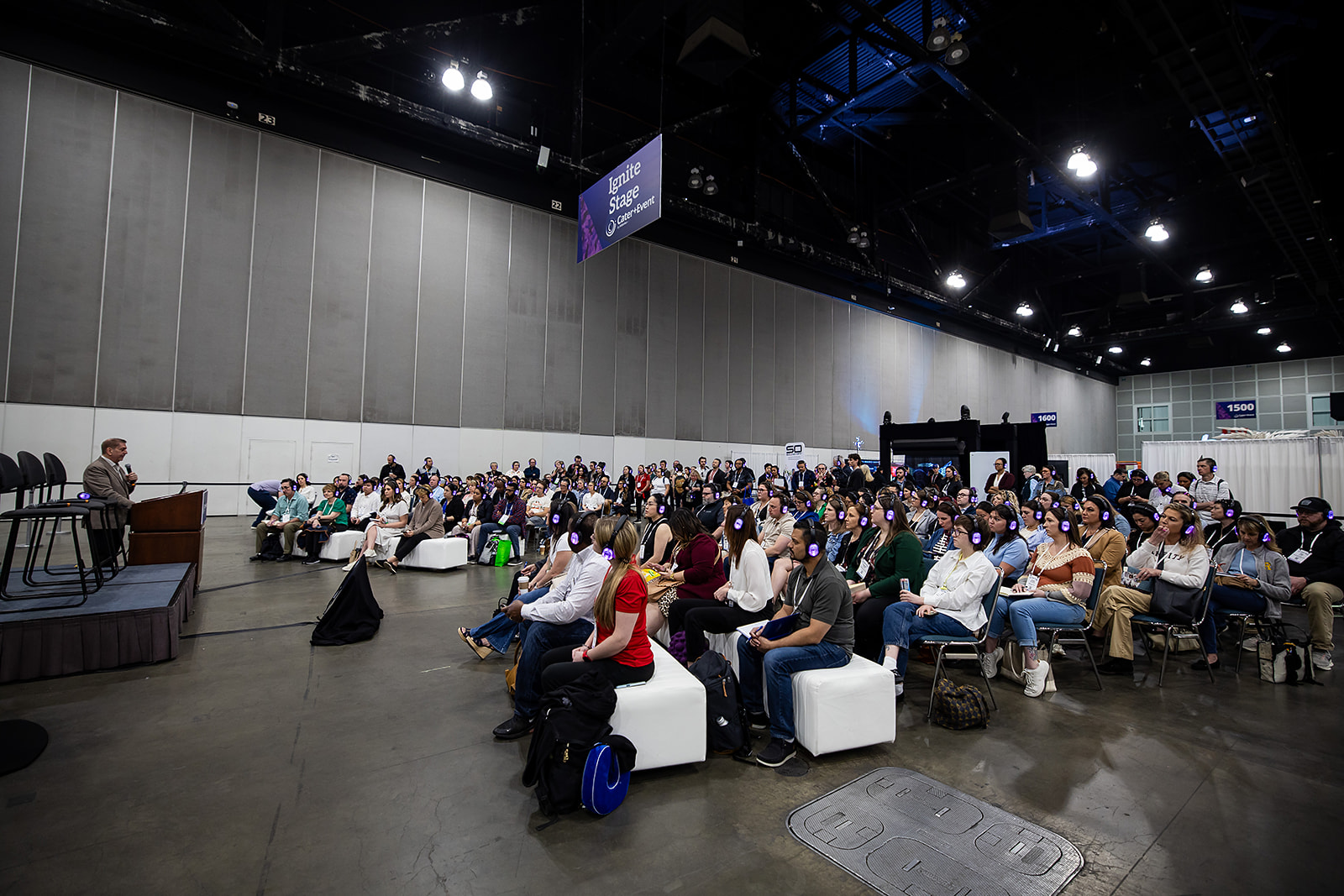 A speaker holding a microphone