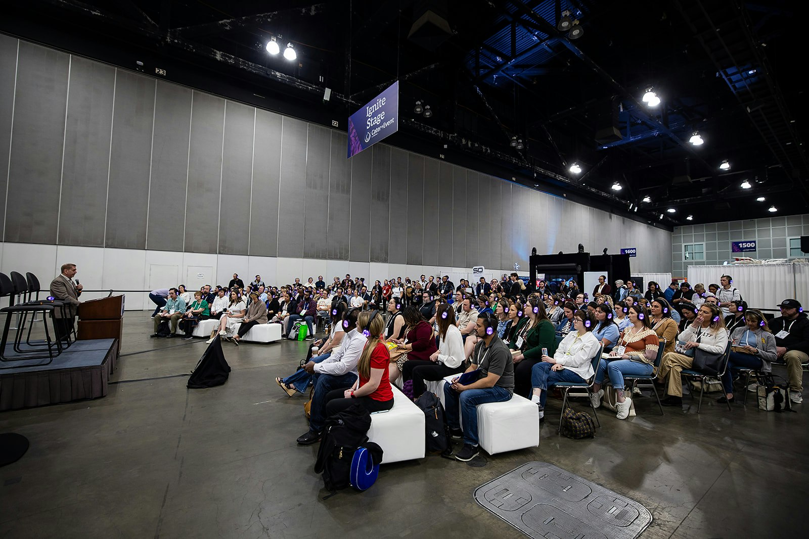A speaker holding a microphone