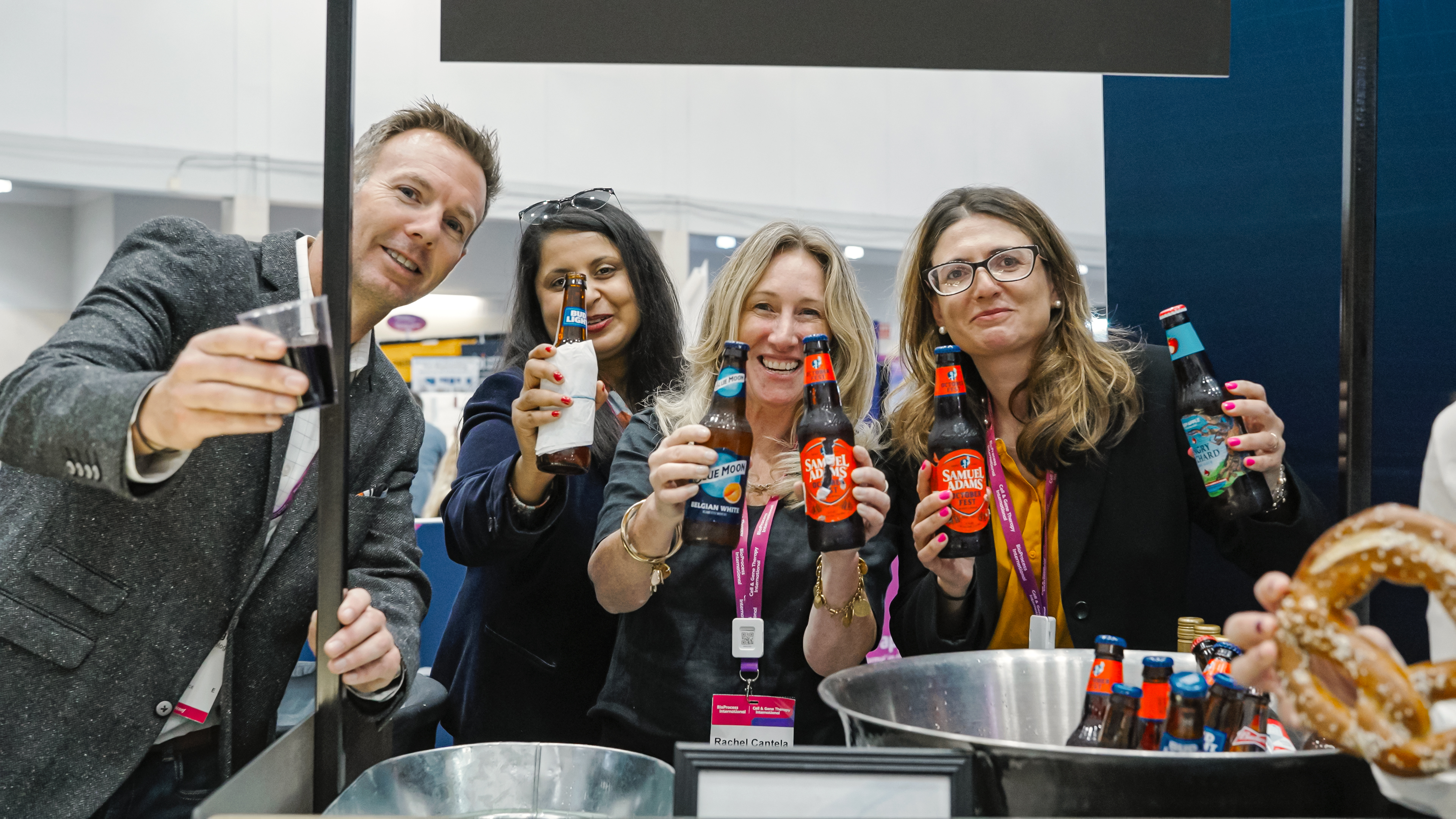 Picture of attendees at BioTech Week Boston networking with drinks.