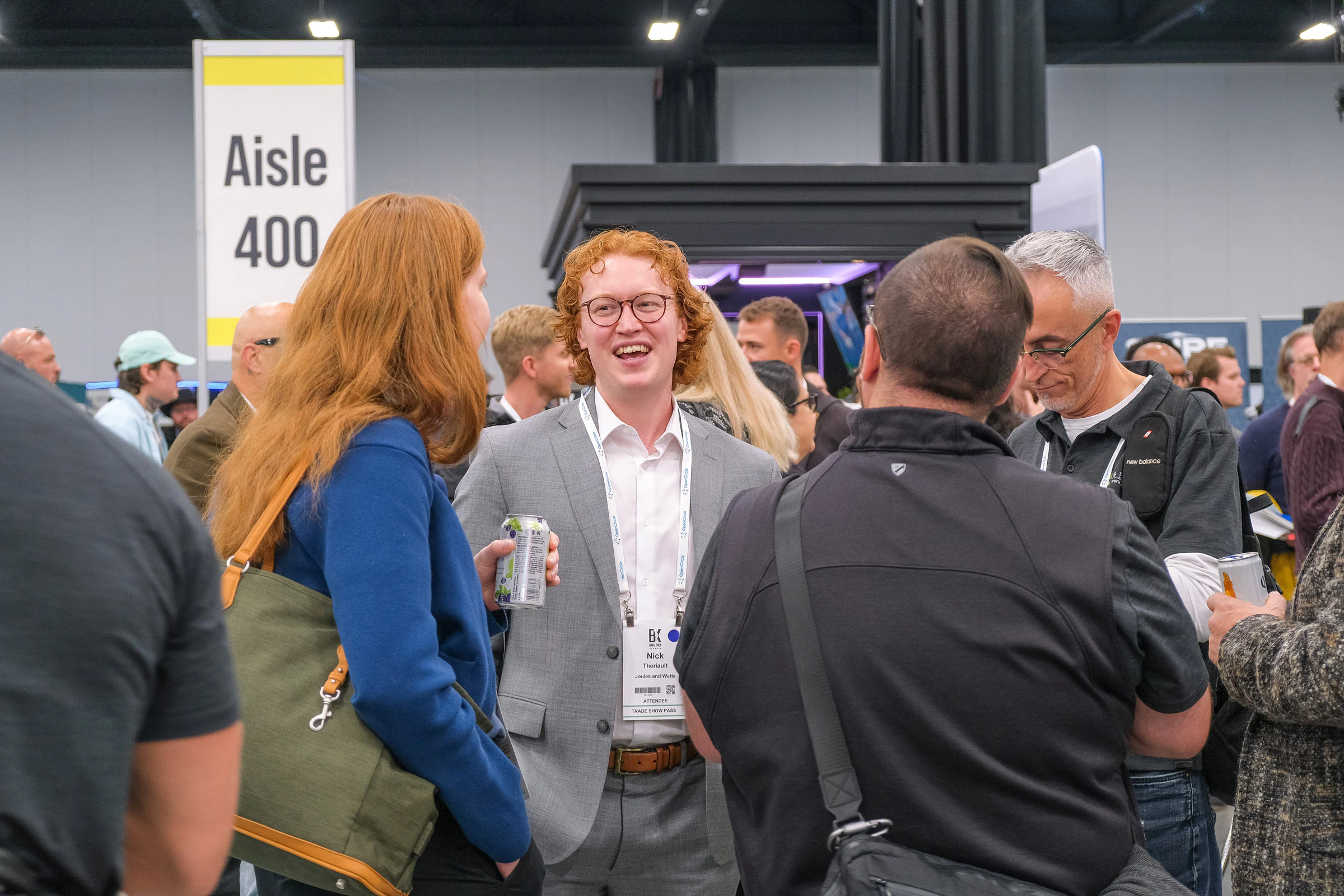 Small group of BUILDEX attendees chatting over drinks at the Industry Networking Reception