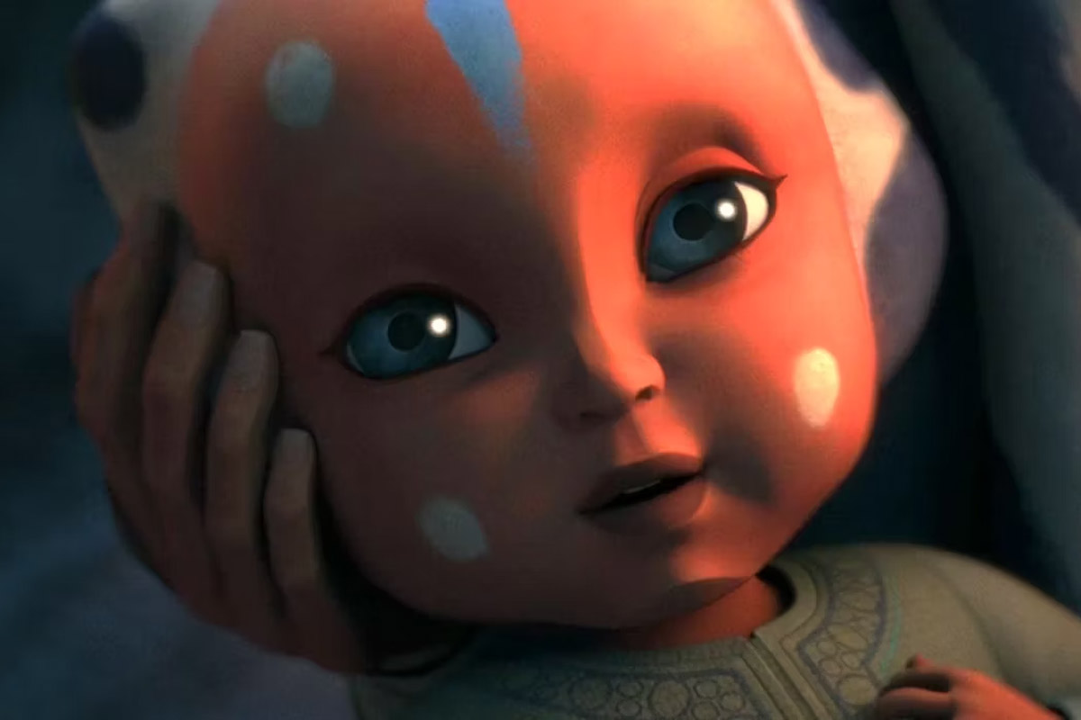 Ahsoka as a baby smiling upwards