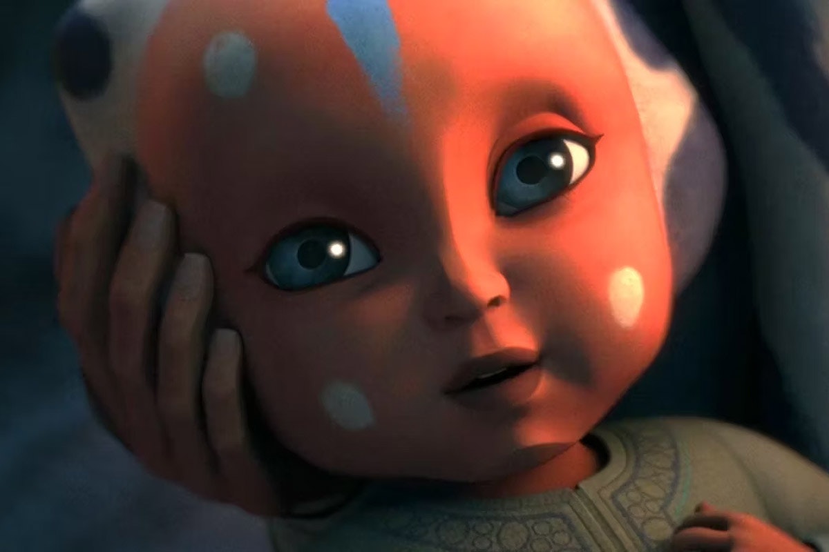 Ahsoka as a baby smiling upwards